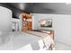 Comfortable bedroom featuring a custom wood bookcase and a wall mounted TV at 2867 S Oswego Ct, Aurora, CO 80014