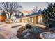 Charming single-story home featuring a landscaped front yard with stone and driveway at 2867 S Oswego Ct, Aurora, CO 80014
