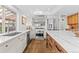 Open kitchen with marble countertops, stainless steel appliances, and an island with bar seating at 2867 S Oswego Ct, Aurora, CO 80014