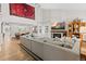 Bright open-concept living room with hardwood floors, a high ceiling, and fireplace at 2867 S Oswego Ct, Aurora, CO 80014