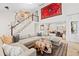 Bright open-concept living room with hardwood floors and high ceiling with gallery wall at 2867 S Oswego Ct, Aurora, CO 80014