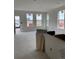 Unfinished living room featuring natural light, white walls, spacious open floor plan at 6562 Arbor Blvd # 5, Thornton, CO 80602