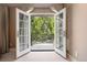 Balcony with view through the french doors at 450 Steele St, Denver, CO 80206