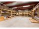Unfinished basement space featuring exposed beams and spacious shelving units at 450 Steele St, Denver, CO 80206