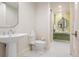 Chic bathroom featuring mosaic tile, modern fixtures, and bright lighting at 450 Steele St, Denver, CO 80206