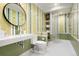 Bright bathroom featuring tiled walls, sleek fixtures, and glass shower stall at 450 Steele St, Denver, CO 80206