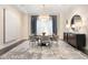 Elegant dining room with chandelier, modern decor, and stylish chairs at 450 Steele St, Denver, CO 80206
