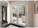 Hallway area with french doors and natural light at 450 Steele St, Denver, CO 80206