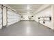 Spacious garage with epoxy flooring, cabinets, and laundry hookups at 450 Steele St, Denver, CO 80206