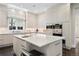 Bright kitchen featuring a large island, stainless steel appliances, and a window that brings in natural light at 450 Steele St, Denver, CO 80206