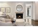 Bright living room with a fireplace, and comfortable seating, offering a cozy and inviting atmosphere at 450 Steele St, Denver, CO 80206