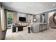 Elegant living room featuring modern furniture, a staircase, and views of the outdoors at 450 Steele St, Denver, CO 80206