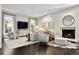 Inviting living room with a fireplace, television, and neutral decor at 450 Steele St, Denver, CO 80206