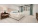 Luxurious main bedroom with plush king bed, bright window, and side tables at 450 Steele St, Denver, CO 80206