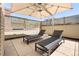 Outdoor patio with lounge chairs and a shade umbrella at 450 Steele St, Denver, CO 80206