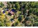 Aerial view of a secluded home nestled within a dense forest at 25357 Snyder Ave, Conifer, CO 80433