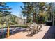Relax on the deck and enjoy beautiful view with outdoor table and chairs at 25357 Snyder Ave, Conifer, CO 80433