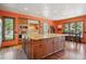 Bright kitchen with island, oak cabinets, and stainless steel appliances at 25357 Snyder Ave, Conifer, CO 80433