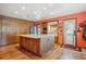 Spacious kitchen with large island, stainless appliances, and wood flooring at 25357 Snyder Ave, Conifer, CO 80433
