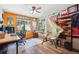Spacious office space with hardwood floors, computer setups, and a window view at 25357 Snyder Ave, Conifer, CO 80433