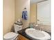 Well-lit bathroom with a sleek vanity and modern fixtures at 11917 Monroe St, Thornton, CO 80233