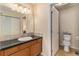 Bright and airy bathroom with large vanity and storage space at 11917 Monroe St, Thornton, CO 80233