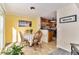 A cozy dining area connected to the kitchen featuring wood floors and lots of natural light at 11917 Monroe St, Thornton, CO 80233