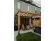 Backyard with pergola and outdoor seating with a fire pit and a hot tub at 527 Fox St, Denver, CO 80204