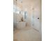 Serene bathroom featuring a soaking tub, elegant chandelier, and stylish honeycomb floor tiles at 527 Fox St, Denver, CO 80204