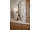 Stylish bathroom vanity with a marble countertop, wooden cabinets, and modern fixtures at 527 Fox St, Denver, CO 80204