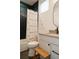 Well-lit bathroom with modern sink, toilet and tile in shower, with whale-themed shower curtain at 527 Fox St, Denver, CO 80204