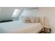 Bright bedroom featuring a plush king-sized bed and skylight at 527 Fox St, Denver, CO 80204
