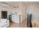 Bright hallway with beverage center and quick access to other rooms in the house at 527 Fox St, Denver, CO 80204