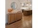Modern kitchen featuring hardwood floors, an island with barstools and pendant lights, and stainless steel appliances at 527 Fox St, Denver, CO 80204