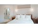 Bright main bedroom with view to ensuite bathroom featuring a glass shower and storage at 527 Fox St, Denver, CO 80204