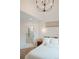 Bright main bedroom with view to ensuite bathroom featuring a glass shower and storage at 527 Fox St, Denver, CO 80204