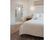 Bright main bedroom with view to ensuite bathroom featuring a glass shower and storage at 527 Fox St, Denver, CO 80204