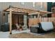 Relaxing patio with a fire pit, hot tub, and outdoor seating area adjacent to the house at 527 Fox St, Denver, CO 80204