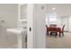 Bathroom with pedestal sink with dining area in the background at 4535 E Montview Blvd, Denver, CO 80207