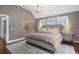 Elegant bedroom with vaulted ceilings, plush carpet, and a tufted headboard for a luxurious feel at 4535 E Montview Blvd, Denver, CO 80207