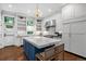 Gourmet kitchen with a large island, custom cabinetry, and high-end stainless steel appliances at 4535 E Montview Blvd, Denver, CO 80207