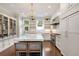 Bright, modern kitchen with white cabinetry, stainless steel appliances, and a center island at 4535 E Montview Blvd, Denver, CO 80207