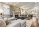 Elegant living room featuring a fireplace, hardwood floors, and coffered ceilings at 4535 E Montview Blvd, Denver, CO 80207
