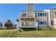 Exterior view showcasing multi-level decks, perfect for outdoor entertaining with grassy backyard at 2179 Sunridge Cir, Broomfield, CO 80020