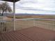 Expansive deck offering stunning panoramic mountain views for outdoor relaxation and entertainment at 2179 Sunridge Cir, Broomfield, CO 80020