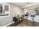 Bright dining area with hardwood floors next to an open kitchen, perfect for everyday living and entertaining at 2179 Sunridge Cir, Broomfield, CO 80020