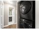 Convenient laundry area featuring a stacked washer and dryer for space-saving functionality at 2179 Sunridge Cir, Broomfield, CO 80020