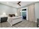 Cozy bedroom with a ceiling fan and sliding doors for seamless indoor-outdoor living at 7952 Dante Dr, Littleton, CO 80125