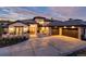 Stunning stone house with a three-car garage and well-manicured landscaping at 7952 Dante Dr, Littleton, CO 80125