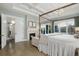 Inviting main bedroom features a fireplace, a four-poster bed, and access to a private balcony at 7952 Dante Dr, Littleton, CO 80125